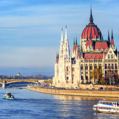 Cruise ships going by Parliament building down the Danube river, Budapest, Hungary