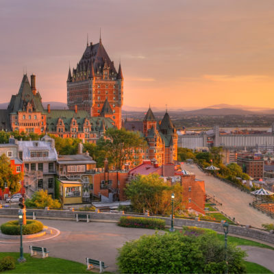 Frontenac Castle in Old Quebec City in the beautiful sunrise light. High dynamic range image. Travel, vacation, history, cityscape, nature, summer, hotels and architecture concept