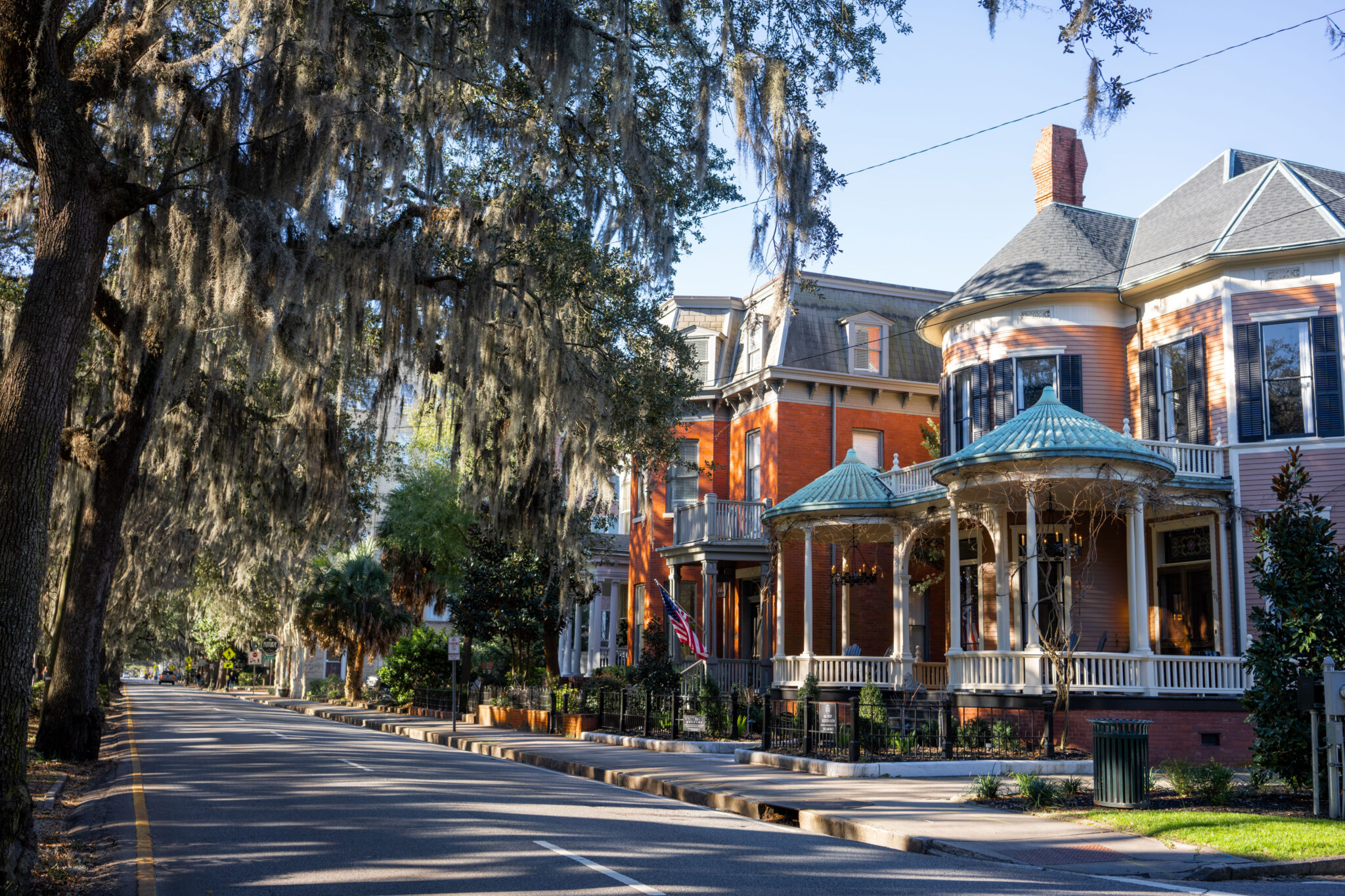 Historic Savannah street lined with homes and Spanish moss